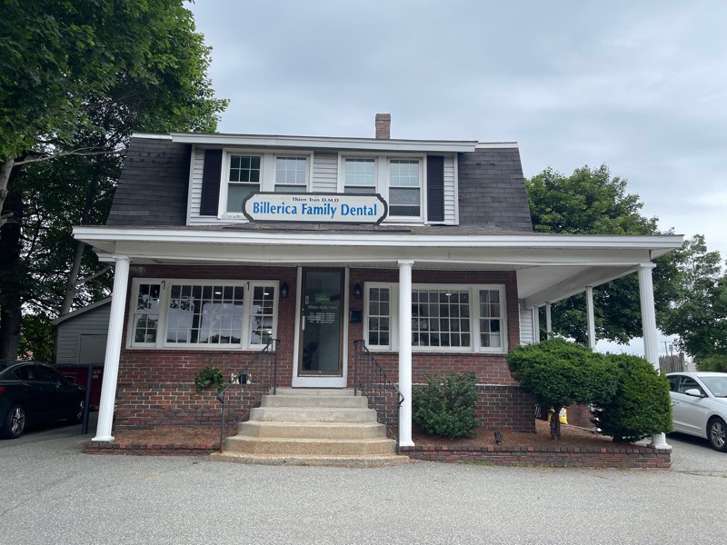 Billerica Family Dental at 474 Boston Road &mdash; a brick colonial with a white columned porch and divided-light windows.